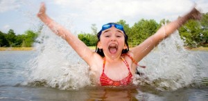 girl-swims-triumphantly-in-lake-612x300